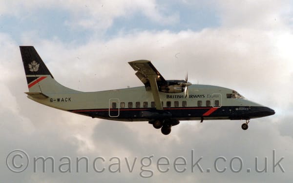 Side view of a boxey, high-winged, twin propellor-engined airliner flying from left to right.