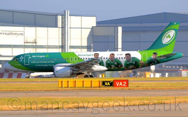Side view of a twin-engined jet airliner taxiing from right to left.