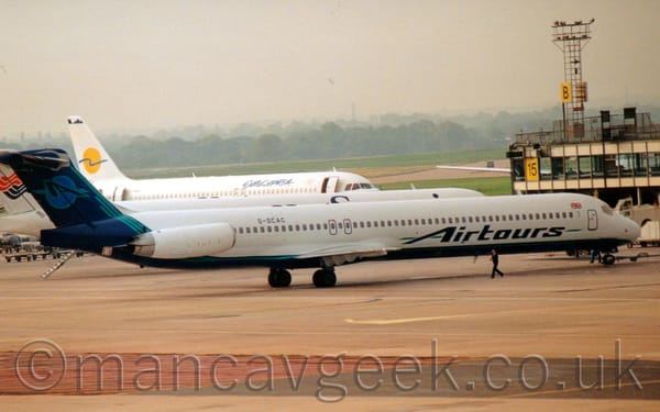 Side view of a white, twin-engined jet airliner with the engines mounted on the sides of the rear fuselage.