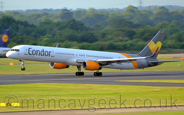 Side view of a twin engined jet airliner moving from right to left at high speed