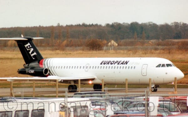 Side view of a twin engined airliner with the engines mounted on the sides of the rear fuselage, taxiing from left to right.