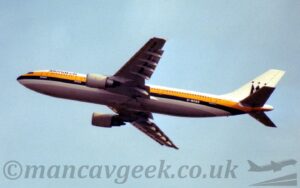 Low side view of a twin engined jet airliner flying from right to left at a low altitude, with undercarriage retracted, flaps extended from the rear of the wings, and the nose raised steeply, suggesting it has just taken off. The plane is mostly white, with a thick yellow stripe running along the body, covering the passenger cabin windows, with a slightly thinner black stripe below that, then a white stripe, with a grey belly beneath. There are black "Monarch" titles on the upper forward fuselage, and white registration "G-MONR" on the black stripe on the lower rear. The registration is repeated in black on the underside of the outer panels of the left wing. White engine pods are mounted below the wings. A stylised black upper-case letter "M" sits in the middle of the white tail, with 3 black dots above the 3 points, making it resemble a crown. Pale blue sky fills the rest of the frame.