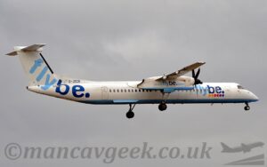 Low side view of a high-winged, twin propellor-engined airliner flying from left to right at a low altitude, with undercarriage lowered and flaps extended behind the wings, suggesting it is about to land. The plane is mostly white, with light and dark blue "FlyBe" titles on the side of the forward fuselage, over 6 coloured dots - 2 yellow, 2 red, and 2 purple/ Larger, light and dark blue "FlyBe" titles fill the white tail and rear fuselage, with the dark blue registration "G-JECR" on a white fillet at the front of the tail. The web address "WWWDotFlyBeDotCom" is on the side of the engine pods, under the wings, in light and dark blue. Flat grey sky fills the background.